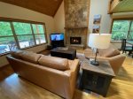 Great room with leather sofas, smart TV streaming only and gas fireplace